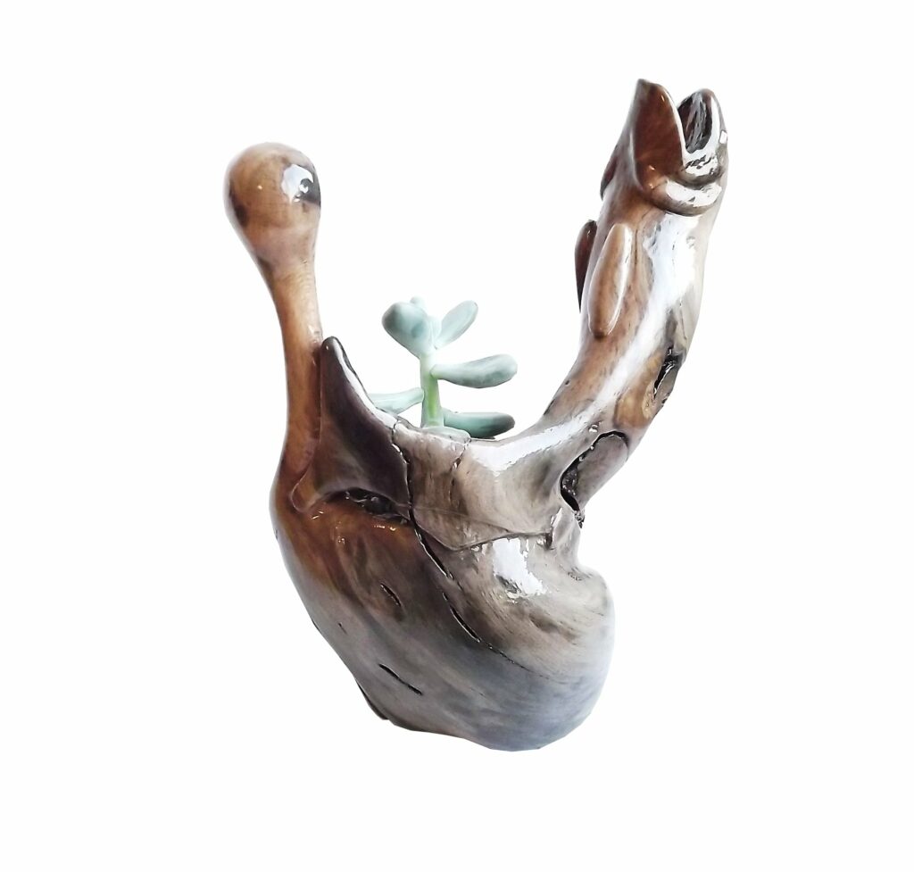 pot de fleur en bois sculpté truite